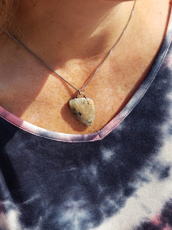 Necklace with a yellow stone on women